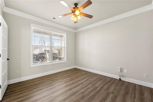 empty room featuring dark wood-type flooring, ceiling fan, and ornamental molding