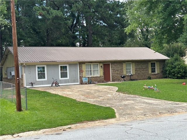 499 Oak Way, Lawrenceville, GA 30046 - single story home with a metal roof and driveway