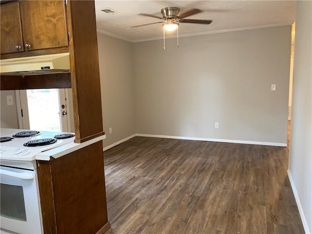 499 Oak Way, Lawrenceville, GA 30046 - kitchen with white range with electric stovetop, dark wood-style flooring, under cabinet range hood, ceiling fan, and ornamental molding