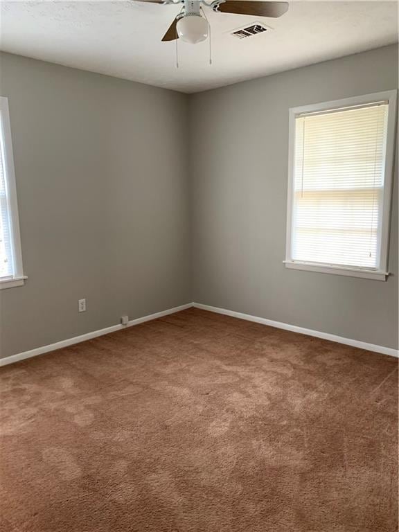 499 Oak Way, Lawrenceville, GA 30046 - empty room with carpet floors and a ceiling fan