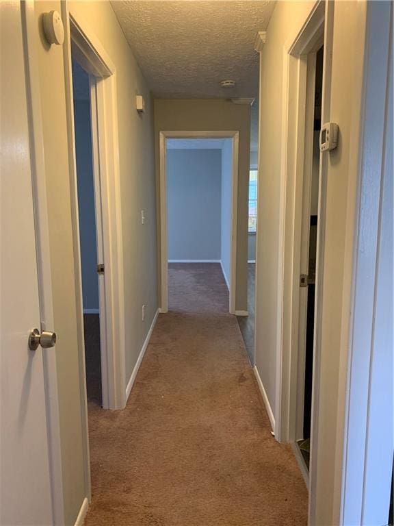 499 Oak Way, Lawrenceville, GA 30046 - hallway with carpet and a textured ceiling