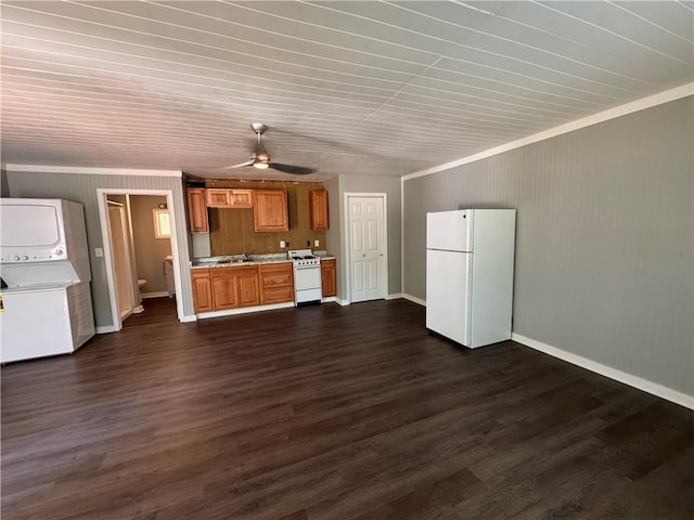 499 Oak Way, Lawrenceville, GA 30046 - unfurnished living room with stacked washing machine and dryer, ceiling fan, dark wood-style floors, and ornamental molding