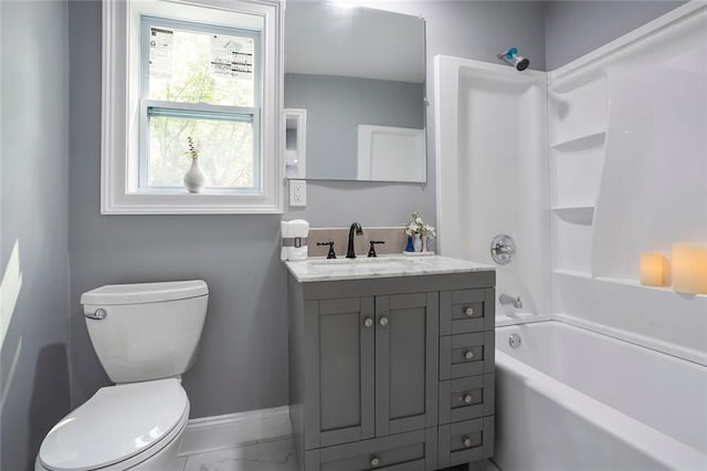 10664 Sandpiper Rd, Jonesboro, GA 30238 - bathroom with marble look tiles, baseboards, toilet, vanity, and tub / shower combination