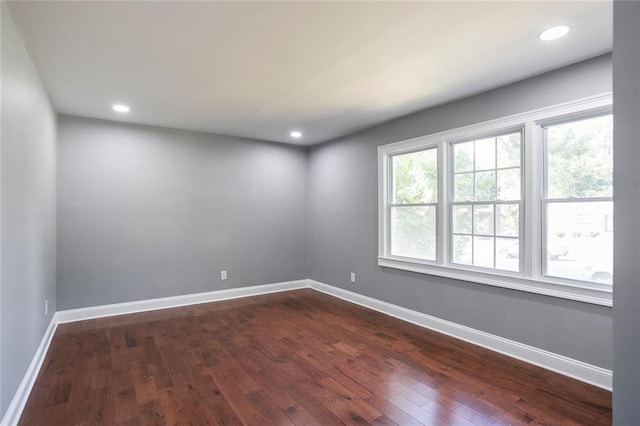 10664 Sandpiper Rd, Jonesboro, GA 30238 - spare room featuring dark wood finished floors, baseboards, and recessed lighting