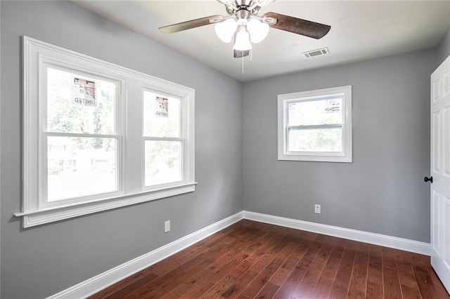 10664 Sandpiper Rd, Jonesboro, GA 30238 - unfurnished room with baseboards, dark wood-style floors, and a ceiling fan