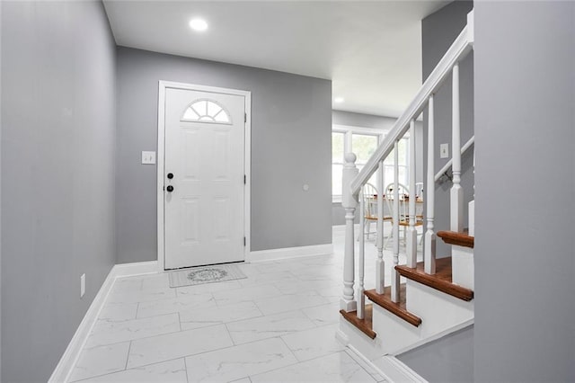 10664 Sandpiper Rd, Jonesboro, GA 30238 - entryway with marble look tile flooring, stairs, baseboards, and recessed lighting