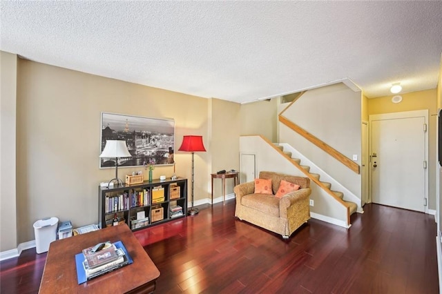 145 15th St NE Unit 204, Atlanta, GA 30309 - living room with wood finished floors, stairs, a textured ceiling, and baseboards