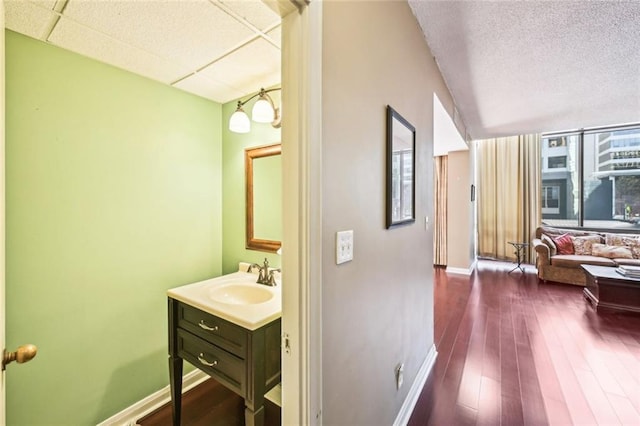 145 15th St NE Unit 204, Atlanta, GA 30309 - bathroom with baseboards, wood finished floors, and vanity