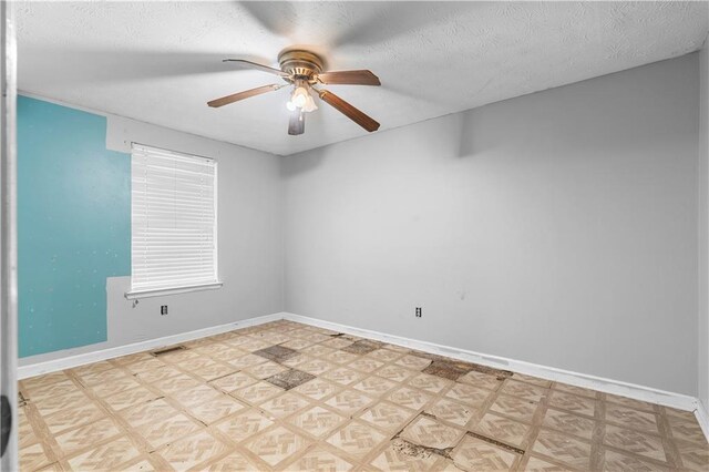 1822 Oriole Trl, Lithia Springs, GA 30122 - empty room featuring ceiling fan, baseboards, and a textured ceiling