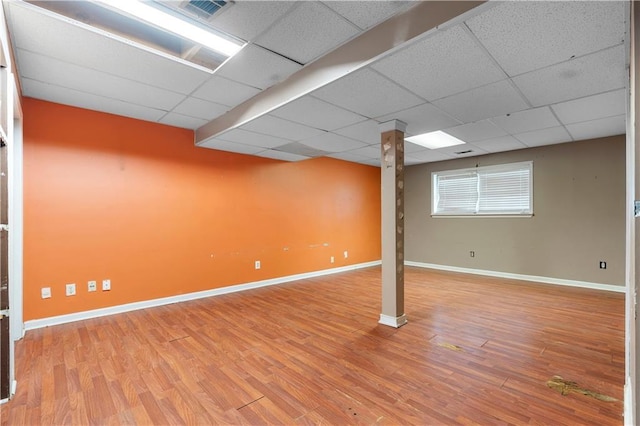1822 Oriole Trl, Lithia Springs, GA 30122 - below grade area with baseboards, a drop ceiling, and wood finished floors