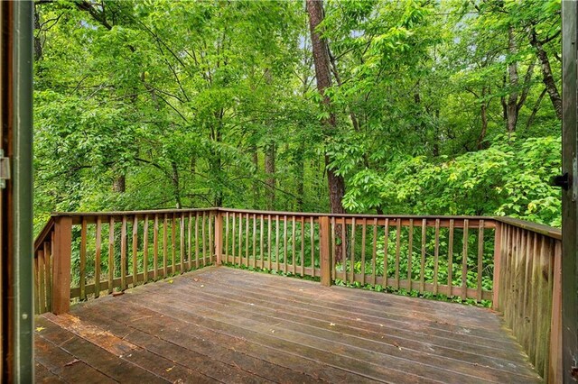 1822 Oriole Trl, Lithia Springs, GA 30122 - wooden deck featuring a wooded view