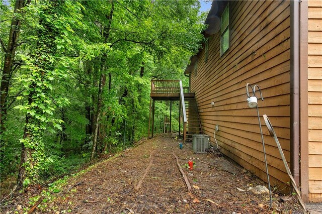 1822 Oriole Trl, Lithia Springs, GA 30122 - view of yard featuring a deck and central AC