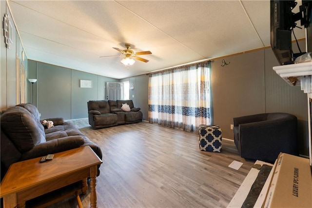 518 W Nance Springs Rd, Resaca, GA 30735 - living area with ceiling fan, wood finished floors, and a decorative wall