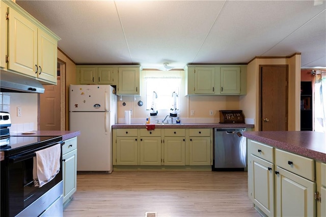 518 W Nance Springs Rd, Resaca, GA 30735 - kitchen with stainless steel appliances, under cabinet range hood, and light wood-style flooring