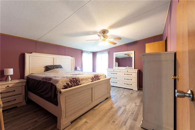 518 W Nance Springs Rd, Resaca, GA 30735 - bedroom featuring light wood-style flooring, a textured ceiling, and ceiling fan