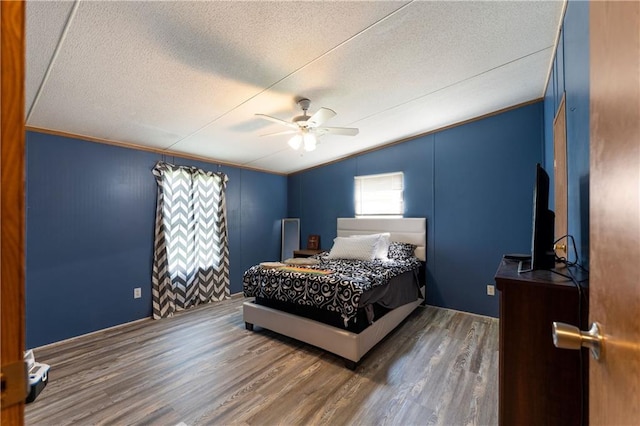 518 W Nance Springs Rd, Resaca, GA 30735 - bedroom with a textured ceiling, wood finished floors, lofted ceiling, and a ceiling fan