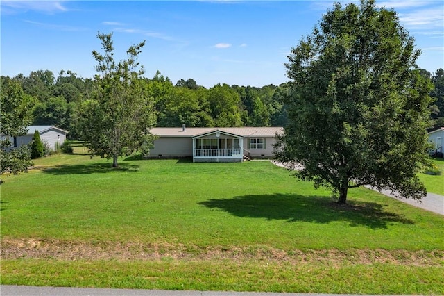 518 W Nance Springs Rd, Resaca, GA 30735 - view of front facade featuring a front lawn and a sunroom