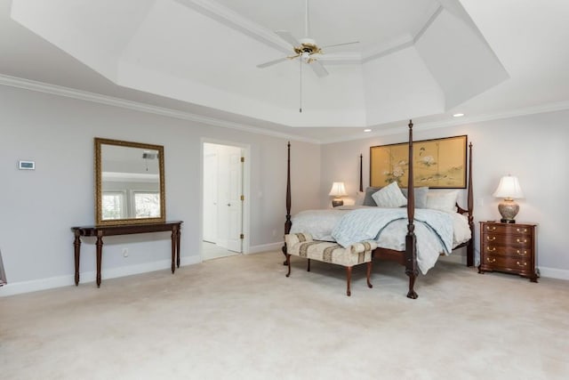 bedroom with light carpet, ornamental molding, and a raised ceiling