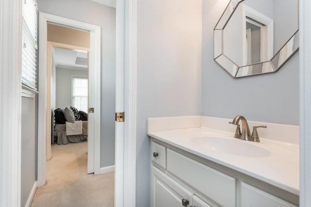 bathroom featuring baseboards and vanity