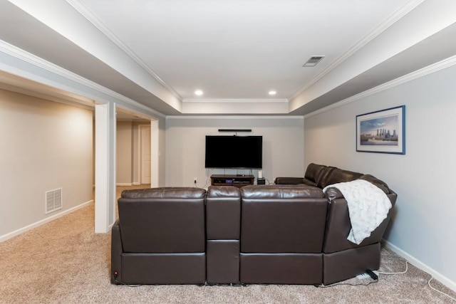 carpeted living room featuring ornamental molding, a tray ceiling, and visible vents