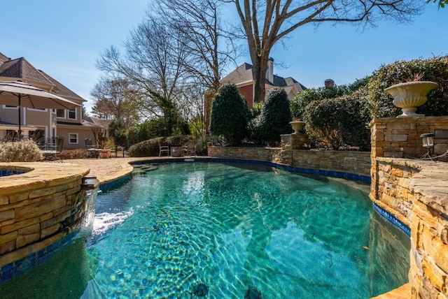 outdoor pool featuring a patio