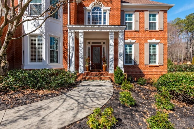 entrance to property with brick siding