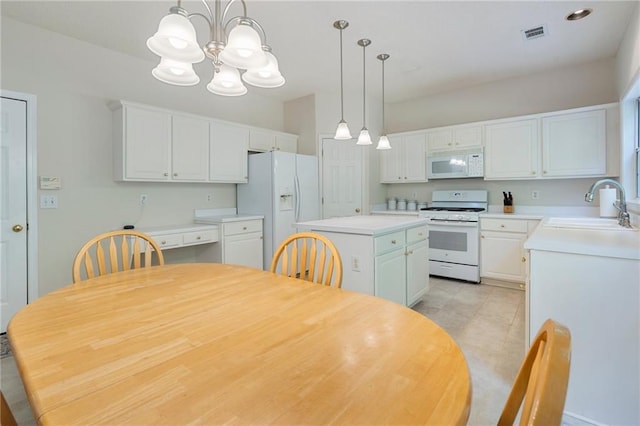 4321 Sugar Maple Chase NW, Acworth, GA 30101 - kitchen with white appliances, a sink, a chandelier, and white cabinetry