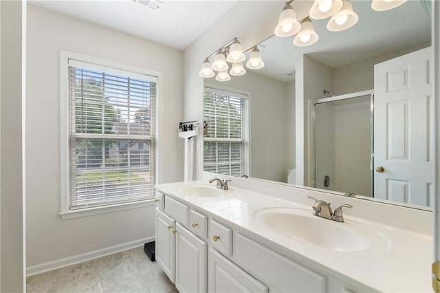 4321 Sugar Maple Chase NW, Acworth, GA 30101 - bathroom featuring a stall shower, double vanity, baseboards, toilet, and a chandelier