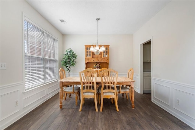 4321 Sugar Maple Chase NW, Acworth, GA 30101 - dining space featuring dark wood-style floors, a chandelier, a decorative wall, and wainscoting