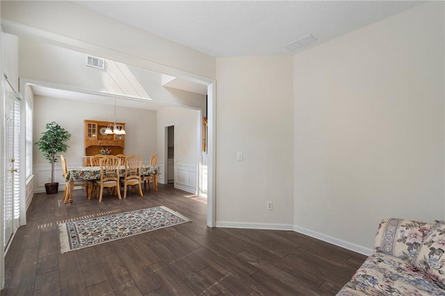 4321 Sugar Maple Chase NW, Acworth, GA 30101 - dining space featuring a chandelier, dark wood-type flooring, and a wainscoted wall