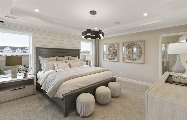 carpeted bedroom featuring baseboards, visible vents, ornamental molding, a raised ceiling, and a notable chandelier