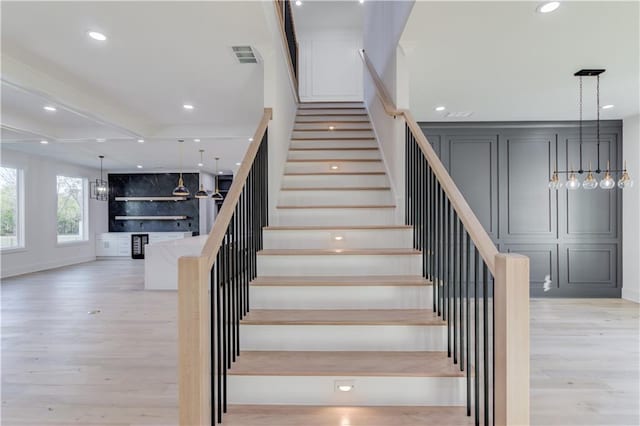 stairway featuring hardwood / wood-style floors