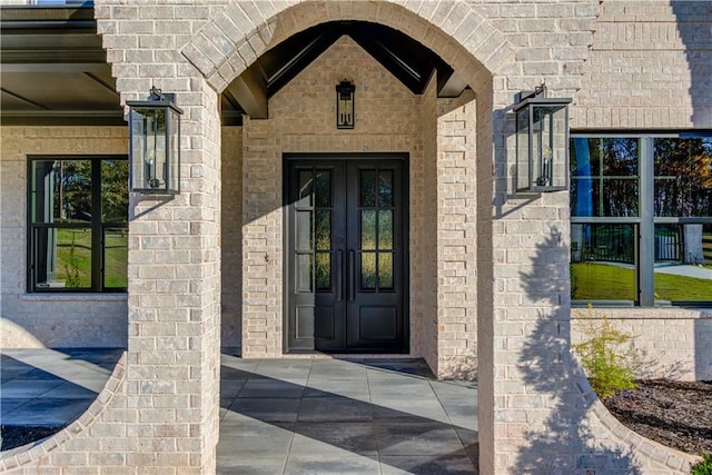 entrance to property featuring french doors