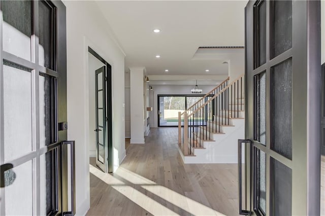 entryway with french doors and light wood-type flooring