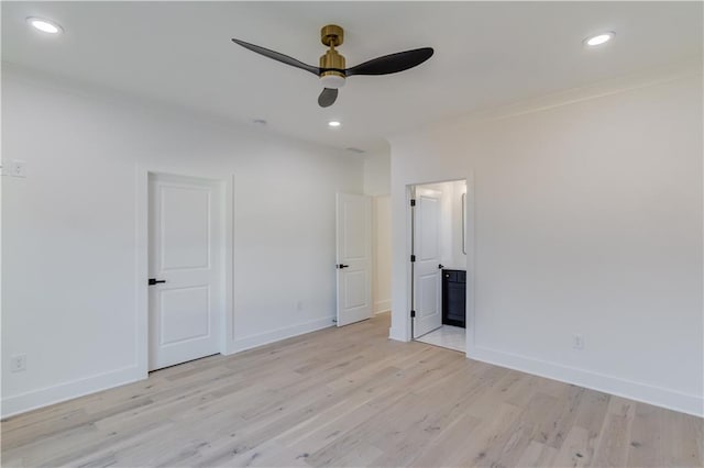 unfurnished bedroom featuring ceiling fan, light hardwood / wood-style floors, ornamental molding, and connected bathroom