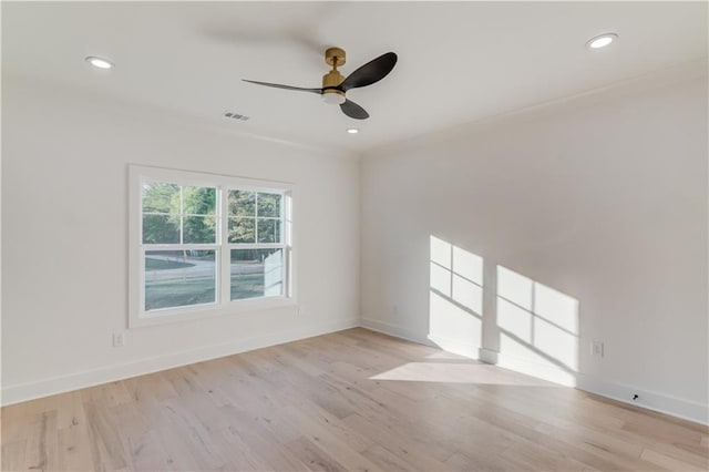 spare room with ceiling fan and light hardwood / wood-style floors