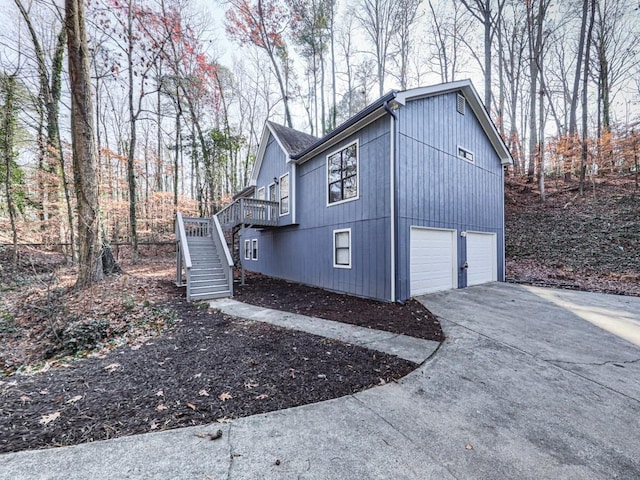 view of side of home with a garage