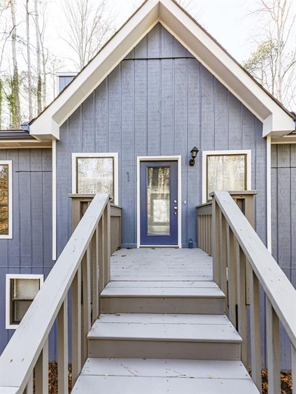 entrance to property with a wooden deck