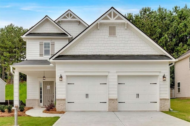 2703 Jordan Ln, Lithia Springs, GA 30122 - craftsman inspired home featuring concrete driveway, roof with shingles, an attached garage, and brick siding