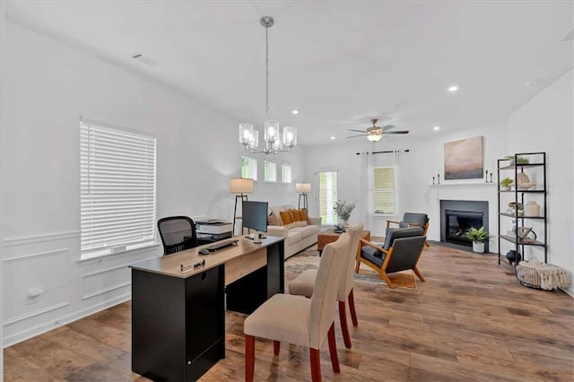 2703 Jordan Ln, Lithia Springs, GA 30122 - office with a glass covered fireplace, a ceiling fan, wood finished floors, recessed lighting, and a chandelier