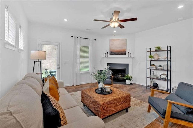 2703 Jordan Ln, Lithia Springs, GA 30122 - living area with ceiling fan, a fireplace, wood finished floors, and recessed lighting