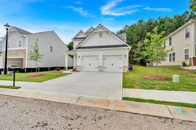 2703 Jordan Ln, Lithia Springs, GA 30122 - craftsman-style house featuring a front yard, driveway, and a garage