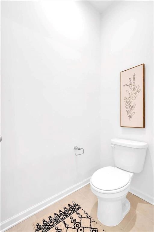 2703 Jordan Ln, Lithia Springs, GA 30122 - bathroom featuring baseboards and tile patterned flooring