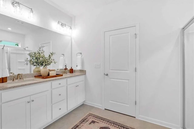2703 Jordan Ln, Lithia Springs, GA 30122 - full bathroom with double vanity and tile patterned floors