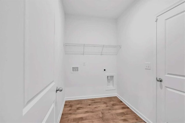2703 Jordan Ln, Lithia Springs, GA 30122 - laundry room featuring hookup for an electric dryer, wood finished floors, and hookup for a washing machine