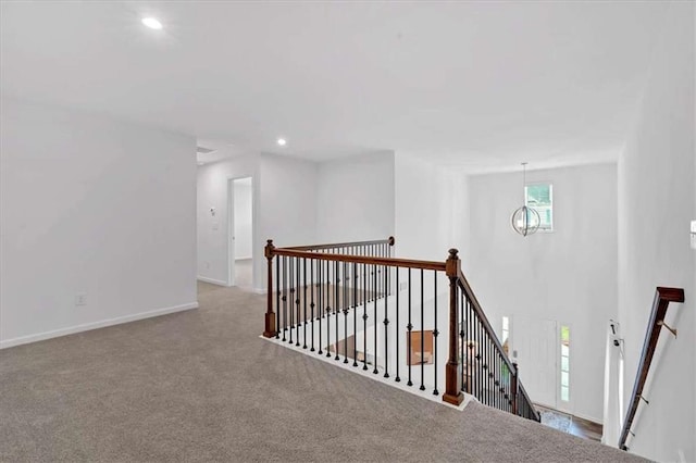 2703 Jordan Ln, Lithia Springs, GA 30122 - hallway featuring an upstairs landing, carpet flooring, recessed lighting, and a chandelier