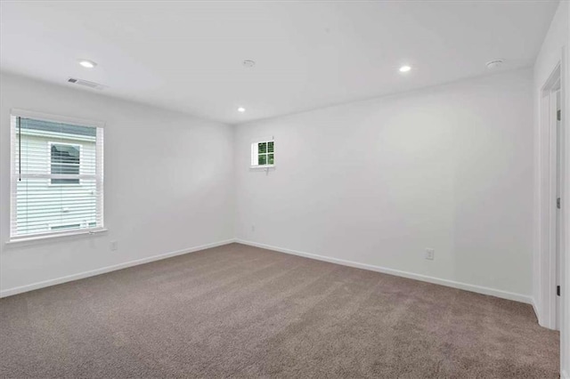 2703 Jordan Ln, Lithia Springs, GA 30122 - unfurnished room featuring carpet flooring, plenty of natural light, and recessed lighting