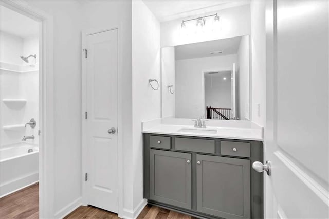 2703 Jordan Ln, Lithia Springs, GA 30122 - full bathroom featuring wood finished floors, vanity, shower / tub combination, and a closet