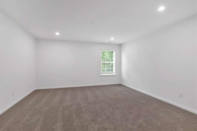 2703 Jordan Ln, Lithia Springs, GA 30122 - spare room featuring recessed lighting and dark colored carpet
