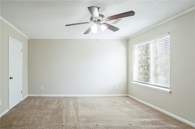 carpeted empty room featuring a textured ceiling, ceiling fan, and ornamental molding